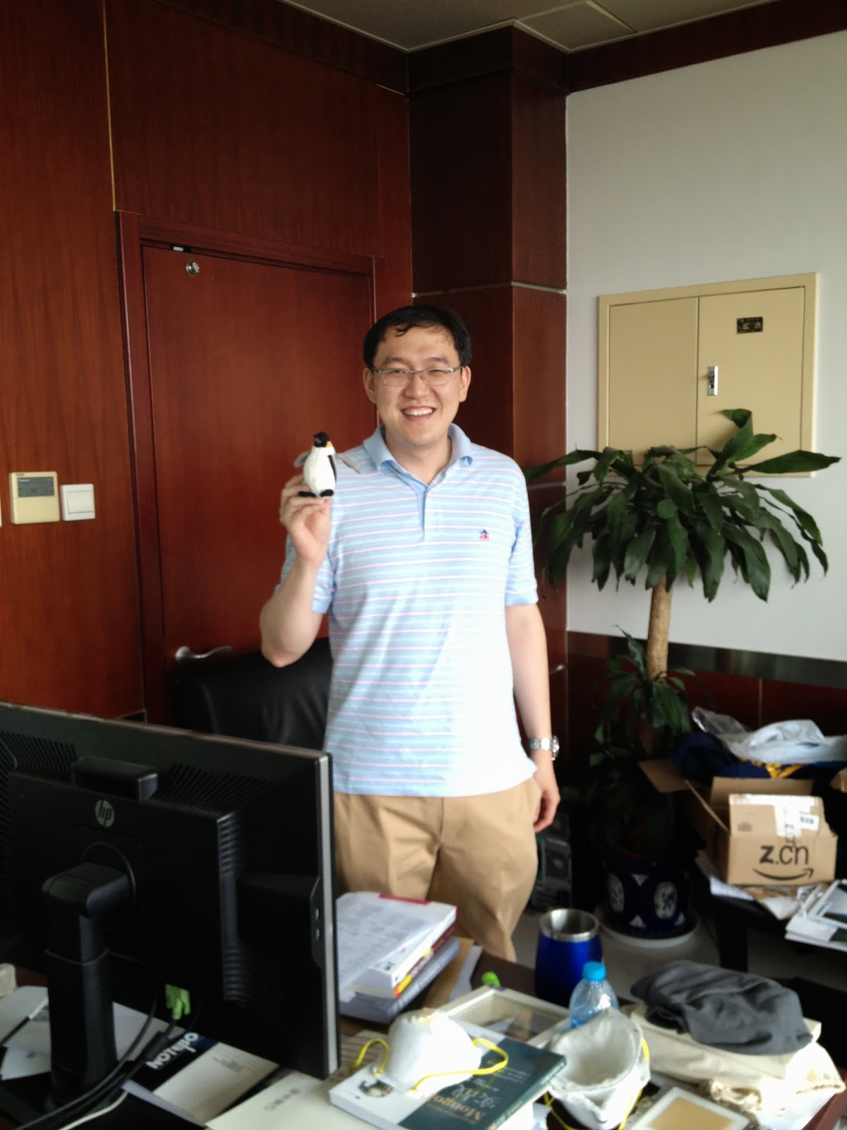Prof. Wei Xu and Travel Penguin.  Wei recently received a shipment from Amazon China, as you can see the box at right