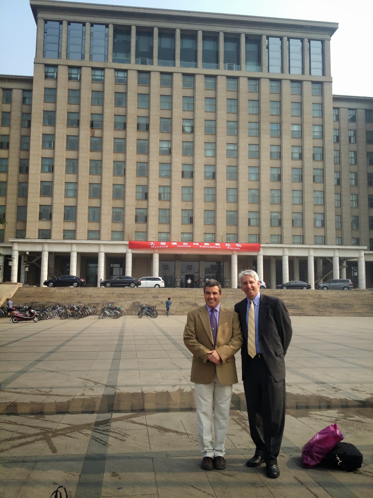 With Howard Lurie of EdX in front of the main (Stalinist-inspired) building of Tsinghua U.  The rest of the campus and most of the other buildings are much more attractive.